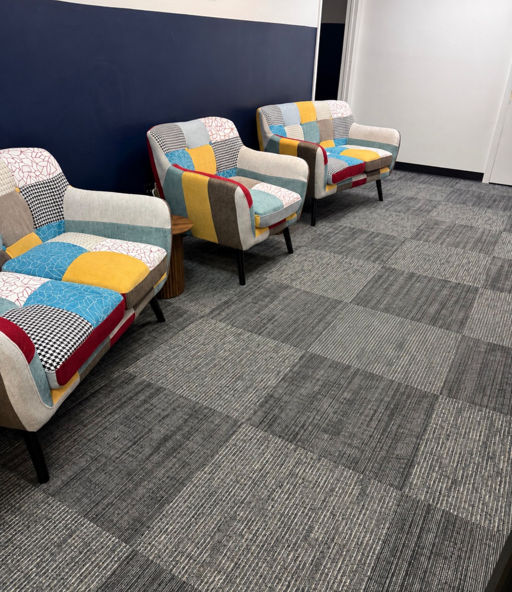 Mamlakah waiting area with patchwork armchairs